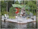 (32/83): Tego mökki strzegą niedźwiedź i pies.<br>2014-08-01